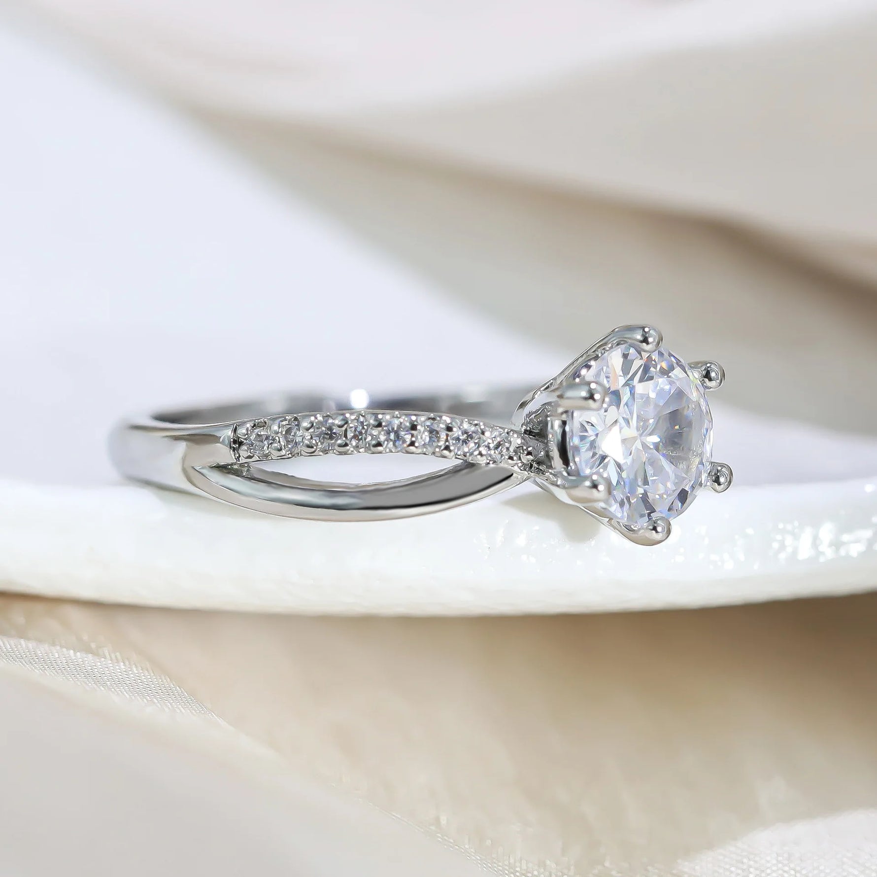 Classic 4-Prong Solitaire Ring with Micro-Pavé Accent Stones & Crisscross Band - 925 Silver Plated White Gold Engagement Promise